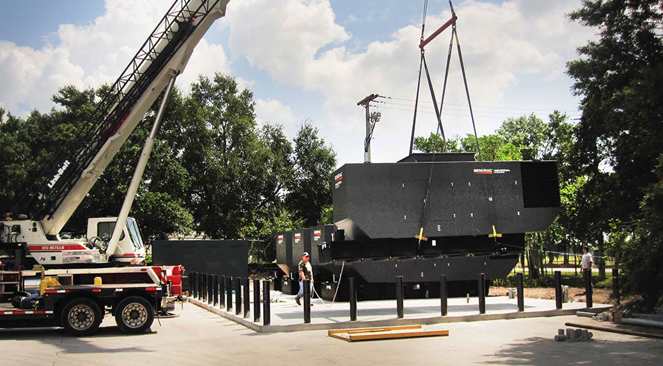 Generac Industrial Bi-fuel generator being moved by a crane