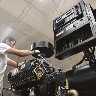 Employee working on a natural gas machine.