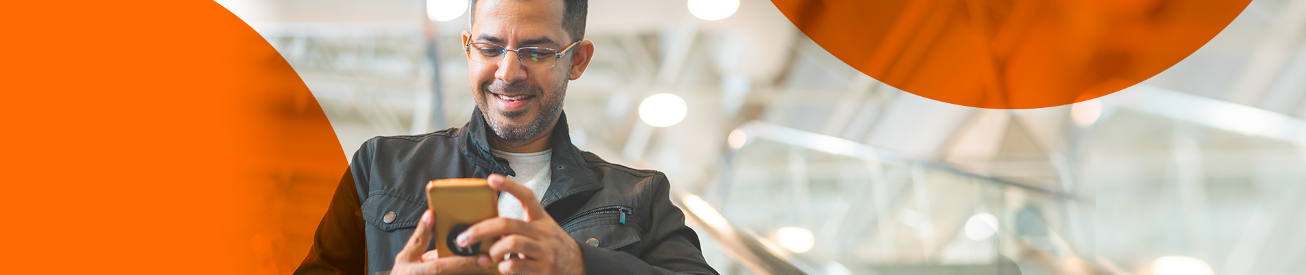 Man holding a phone while using Mobile Link app